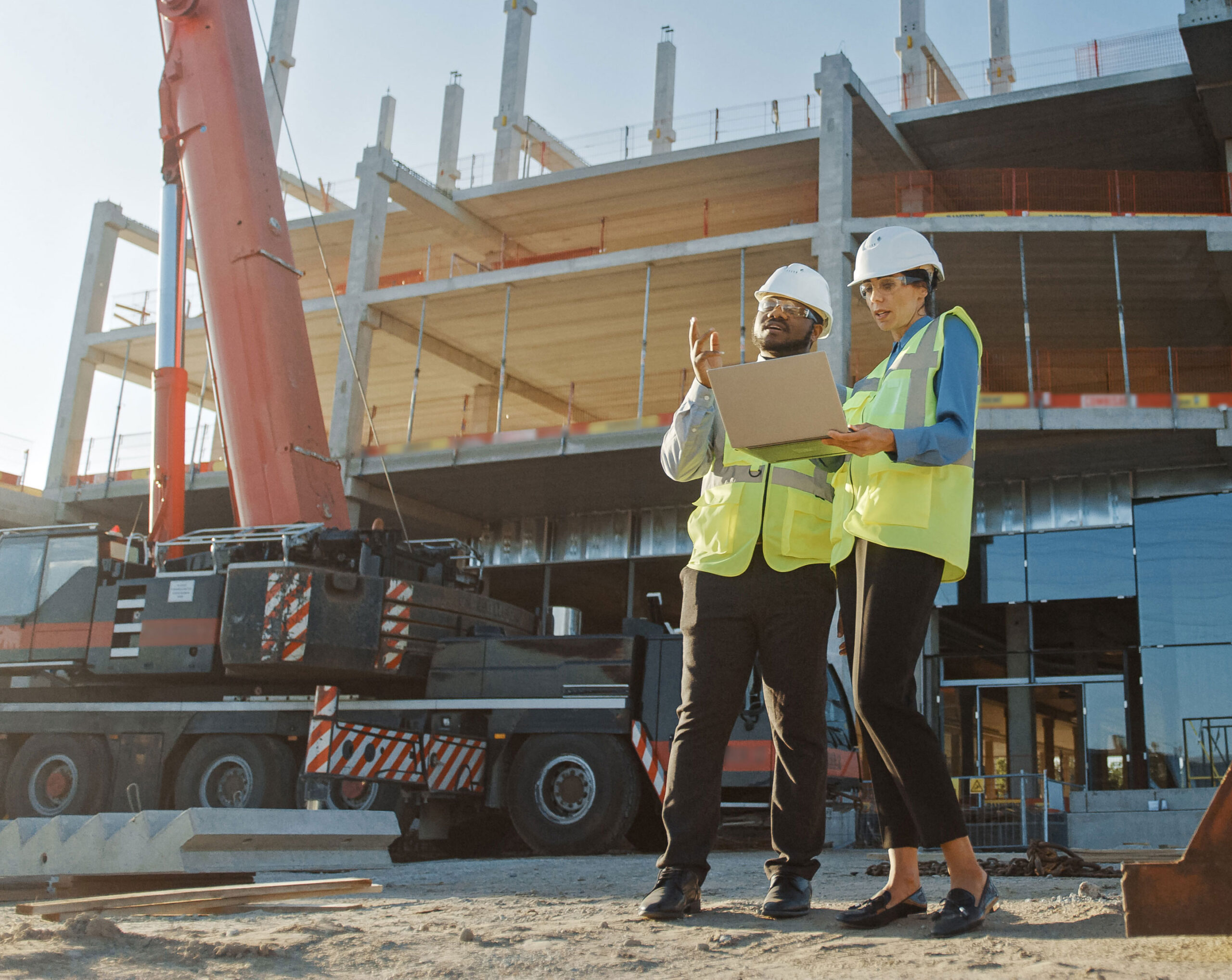 construction workers in from of building site